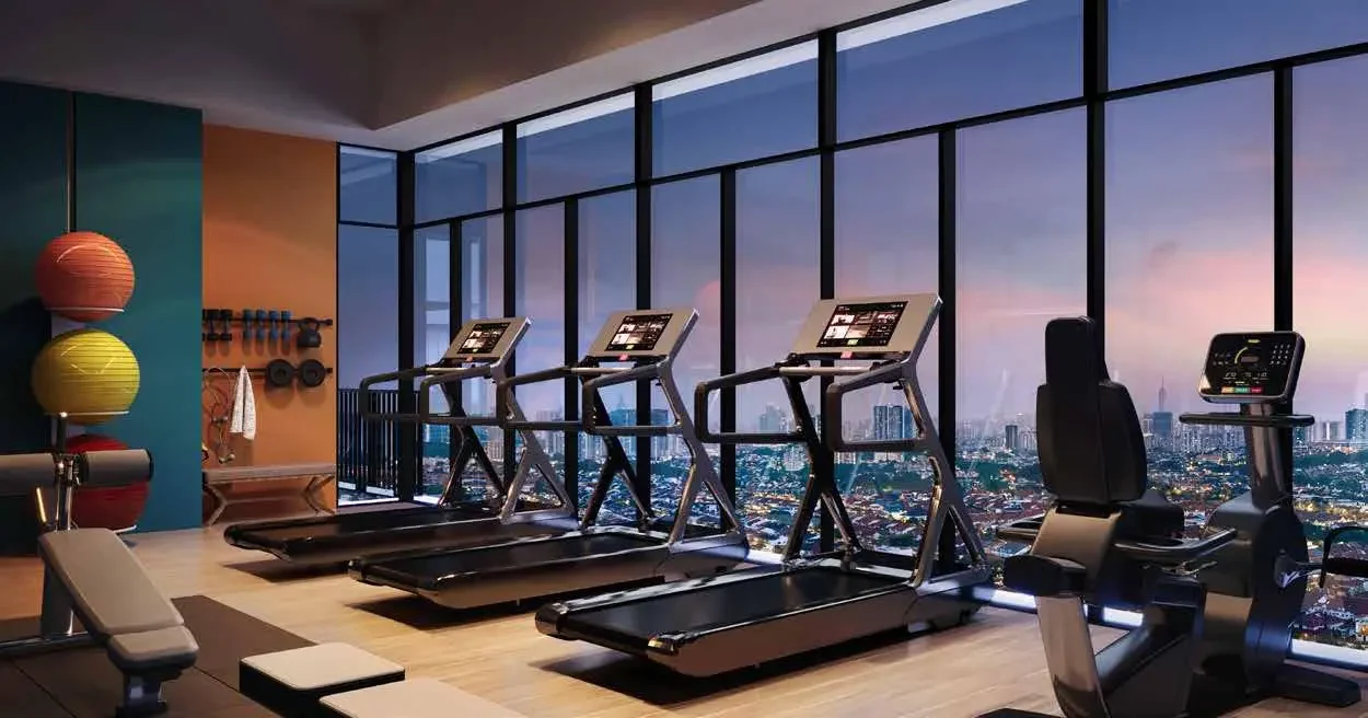 Gymnasium at Aras Residences with full-height glazing over the gardens